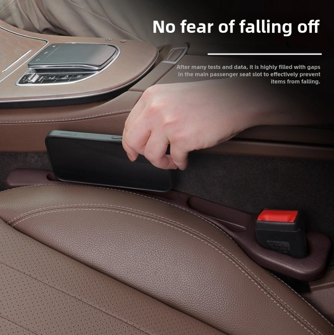 Car seat gap filler being used to prevent items from falling off a car seat.