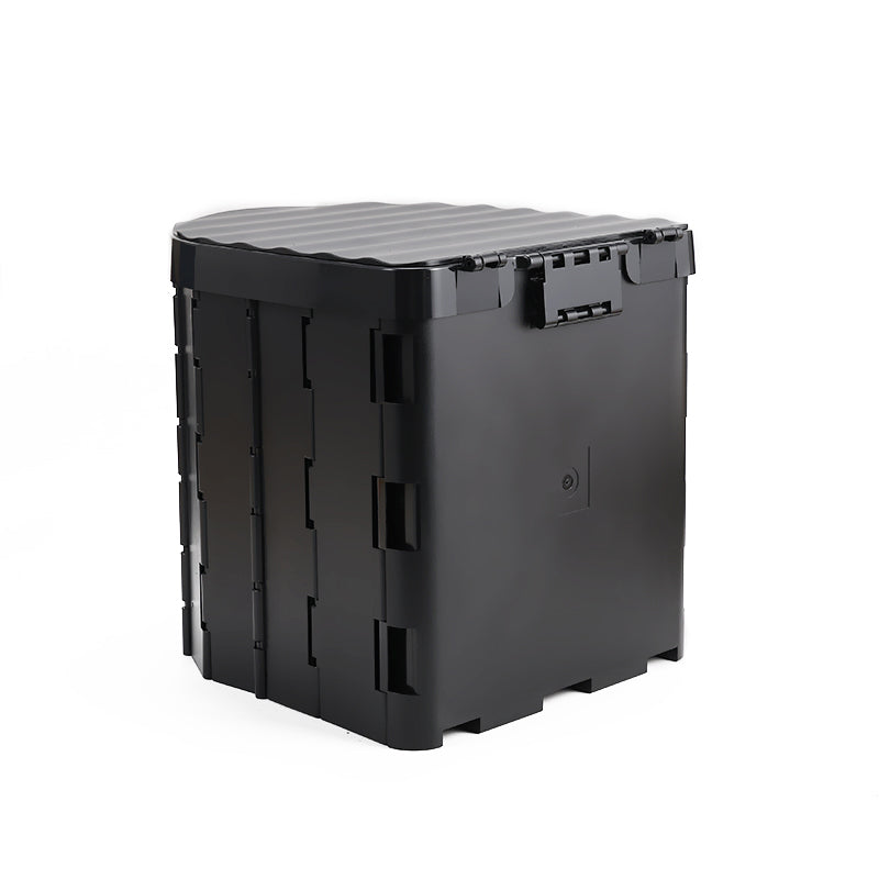 Black portable foldable toilet with a lid on a white background