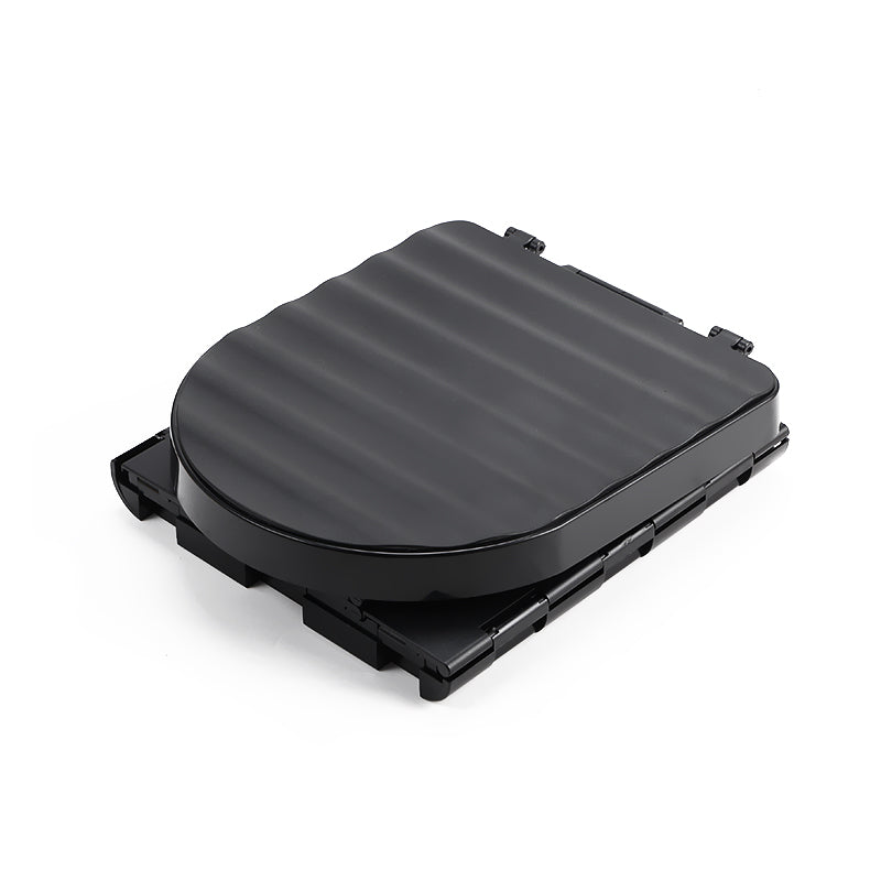 Black folded toilet on a white background