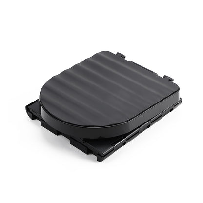 Black folded toilet on a white background